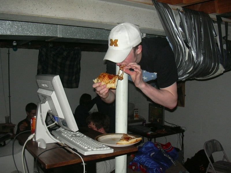 LAN Party guy taped to ceiling