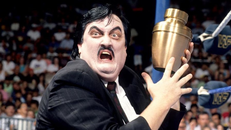 A picture of wrestling manager called Paul Bearer. He is holding an urn and yelling towards the screen.
