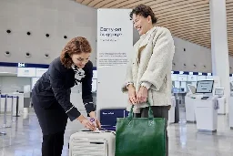 Finnair now weighing passengers at the gate - UPI.com