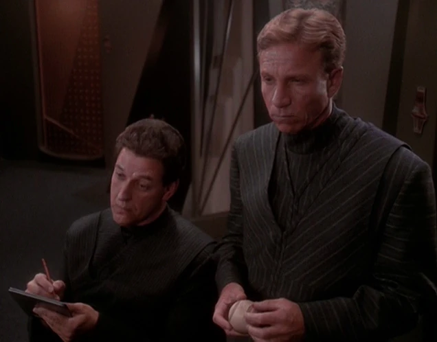 screencap of Dulmur and Lucsly from the Department of Temporal Investigations, in DS9 S05E06 "Trials and Tribble-ations"