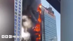 Huge fire rages in China office building