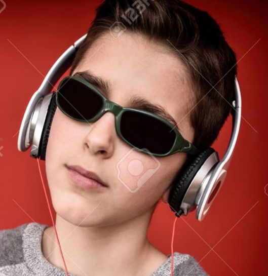 Really cool kid in sunglasses with headphones on