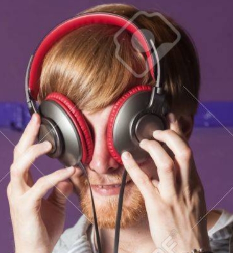some rando holding the headphones up to his eyes like an idiot