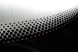 The Real Reason Your Car Windshield Has Those Small Black Dots