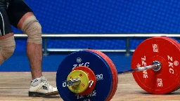 Iran bans weightlifter for life after he shakes Israeli’s hand on podium