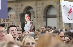 Thousands protest in Poland against strict abortion law after pregnant woman died of sepsis