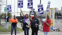 Workers strike at all 3 Detroit automakers, a new tactic to squeeze companies for better pay