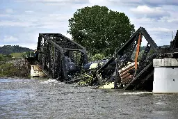 Freight train carrying hot asphalt, molten sulfur plunges into Yellowstone River as bridge fails