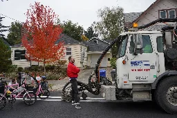 Portlanders stand in front of truck to prevent bike lane removal