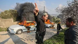 Settlers burn through West Bank village under army protection