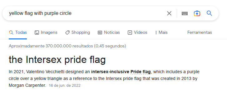 Google search that reads: "yellow flag with purple circle". Google answers: "the Intersex pride flag". Google goes further: "In 2021, Valentino Vecchietti designed an intersex-inclusive Pride flag, which includes a purple circle over a yellow triangle as a reference to the Intersex pride flag that was created in 2013 by Morgan Carpenter."