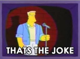 The Simpsons character Rainier Wolfcastle on stage with a microphone, on TV, with the caption "THAT'S THE JOKE"