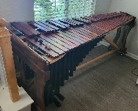 A Marimba I built last year - took me a bit over half a year to complete. 61 keys made of Padauk, all hand-tuned, on a frame of Red Oak and Walnut