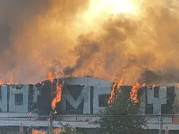 Huge fire ravages former Kmart building in NE Portland, spewing chunky ash across neighborhood