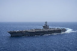 US aircraft carrier's near miss with missile fired by Middle East rebels