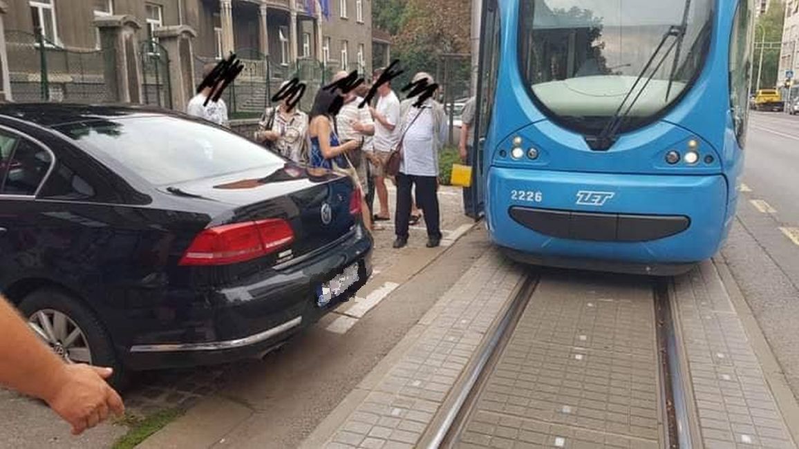 car parked blocking tram