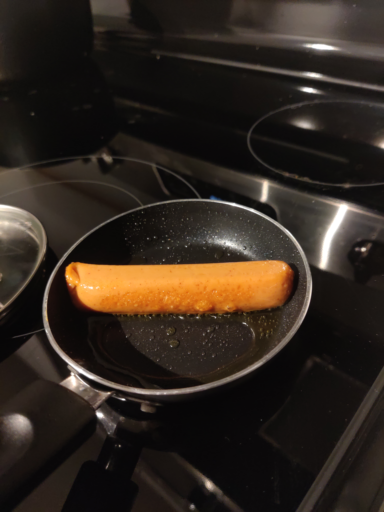 Hot dog in tiny frying pan