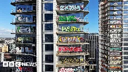 Drone video shows graffiti covering luxury high-rise in LA